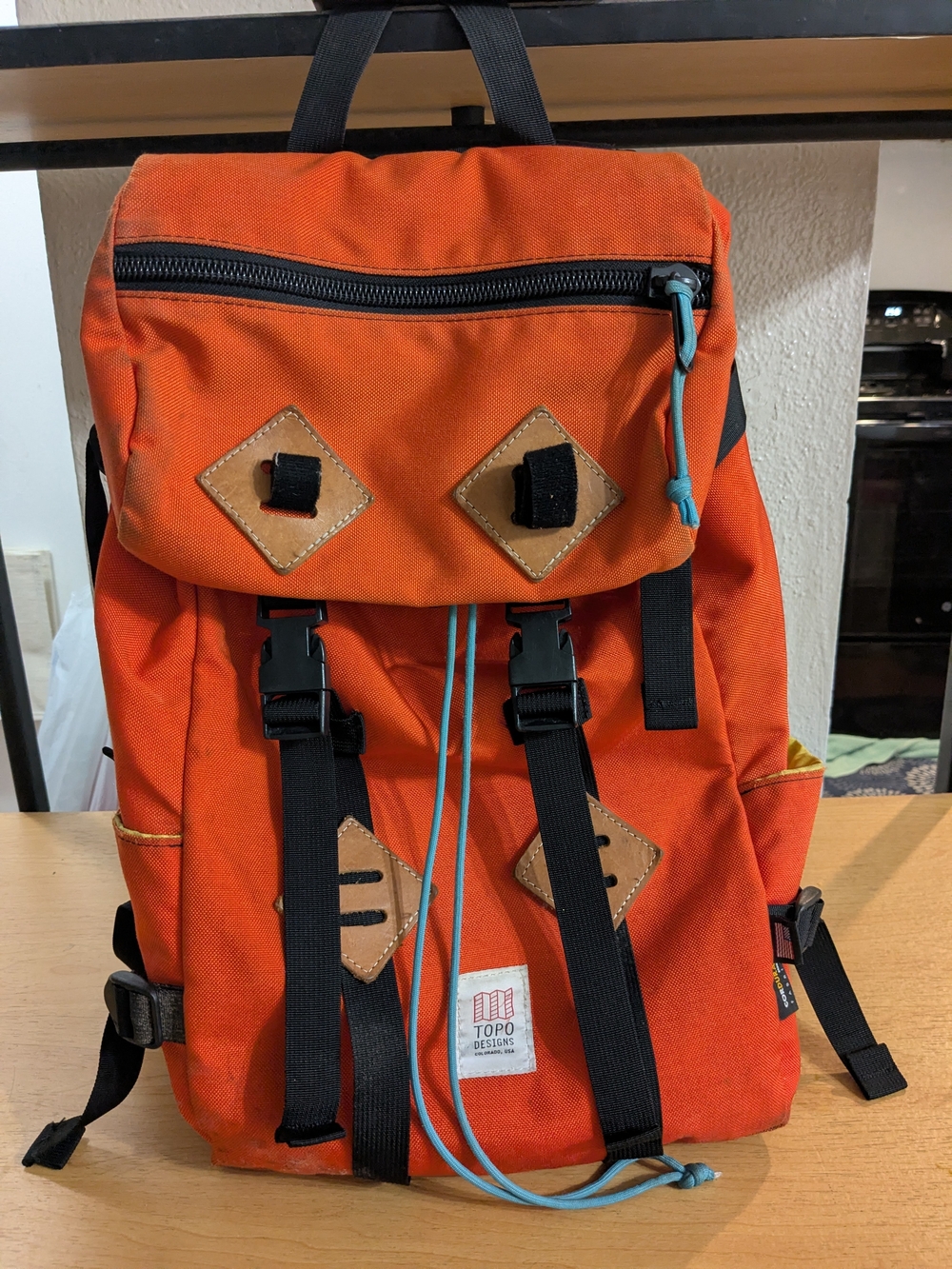 Topo Designs Bright Orange Canvas Rucksack with Contrasting Blue Cord